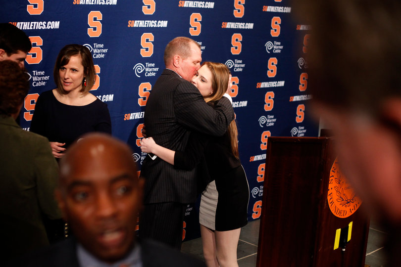 Scott Shafer hugs his daughter after a press conference Friday January 11th, 2013.