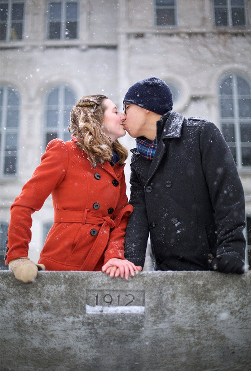 Julie Walas and Binh Huynh share a kiss atop the "kissing bench," the same place they spent their first Valentine's Day as an engaged couple. 