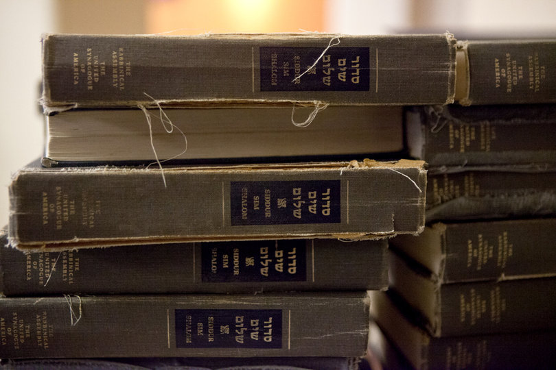The auditorium at Hillel is adorned with holy books and various artifacts.