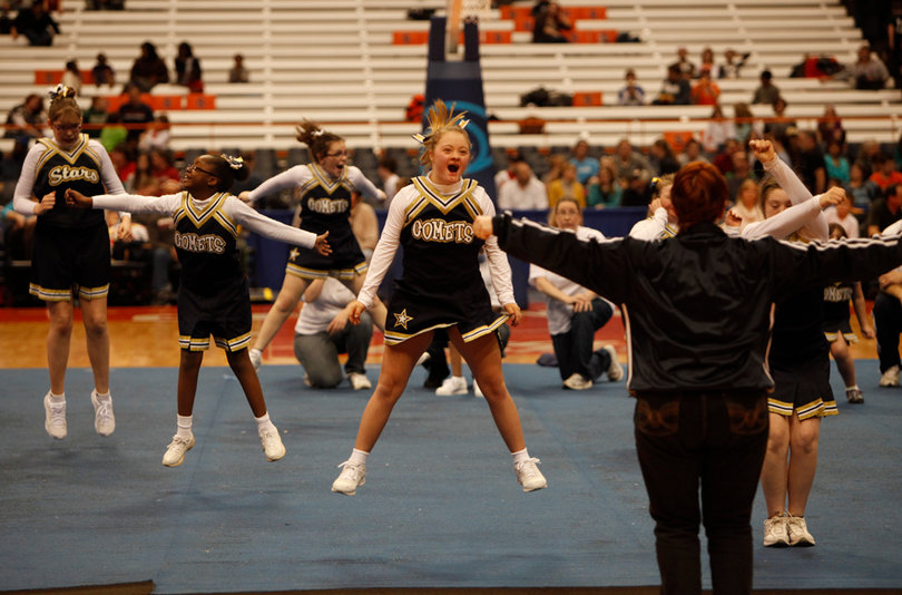 The Comets jump for joy, performing their routine at halftime on Friday.