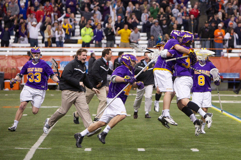 The Albany Great Danes celebrate the first win against Syracuse in program history. Miles Thompson scored the game-winning goal with 3:03 remaining in the second overtime.