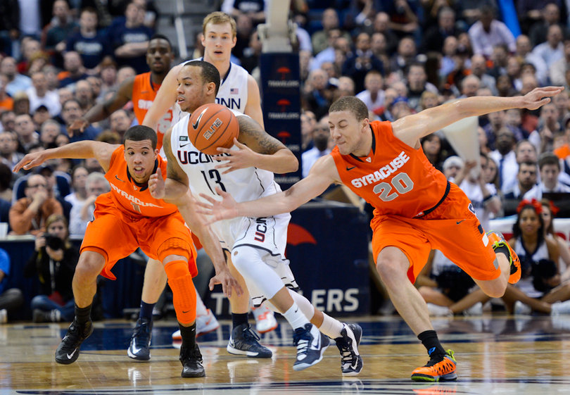 Syracuse guards Michael Carter-Williams and Brandon Triche chase down Connecticut point guard Shabazz Napier.