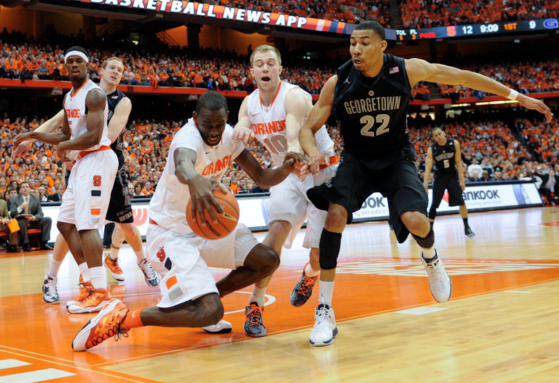 Baye Moussa Keita scrambles for the balll. Keita played just 12 minutes and snagged three rebounds.