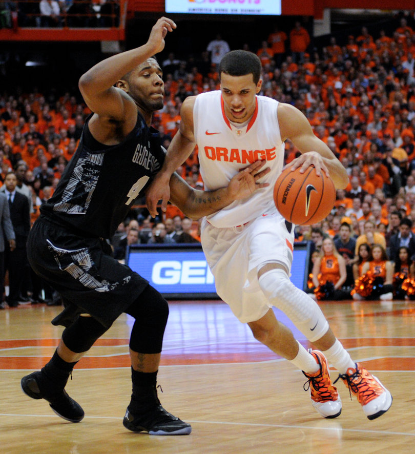 Michale Carter-Williams drives to his left in Saturday's 57-46 loss to Georgetown in the Carrier Dome.