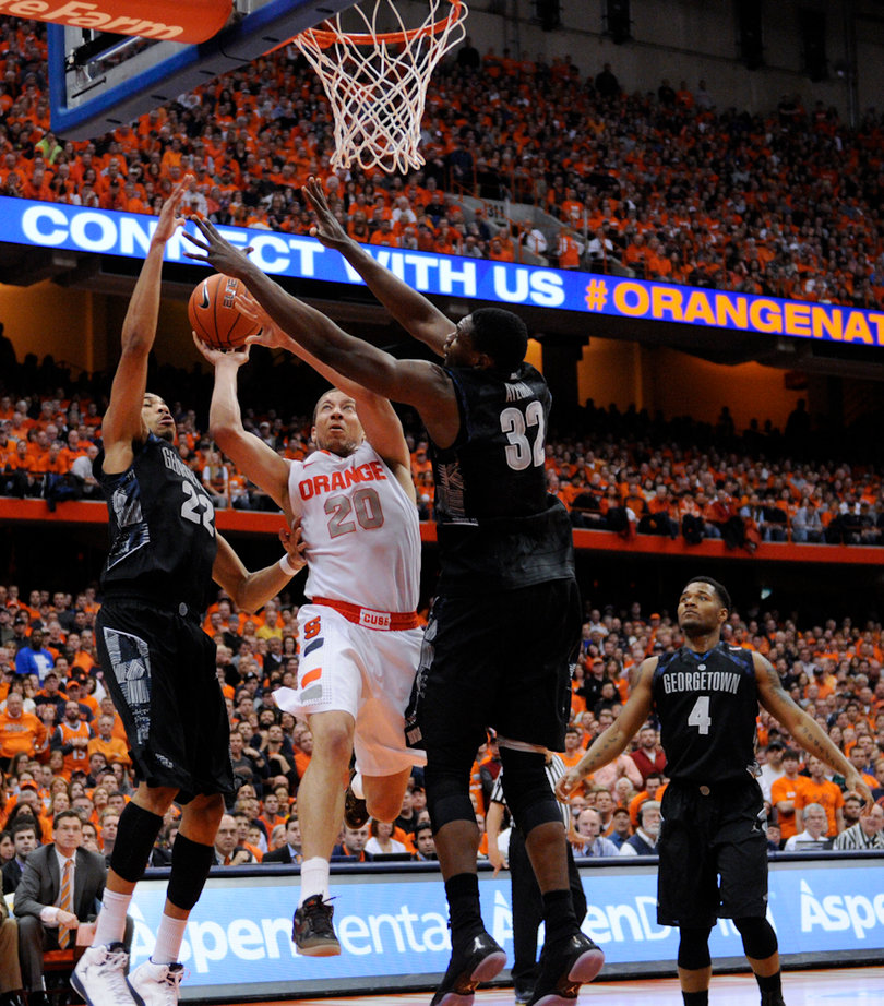 Brandon Triche goes up for a layup against Moses Ayegba.