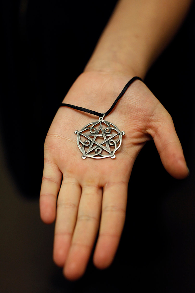 Pentacle: The pentacle represents the unity of the four elements, earth, air, fire and water, and the spirit.