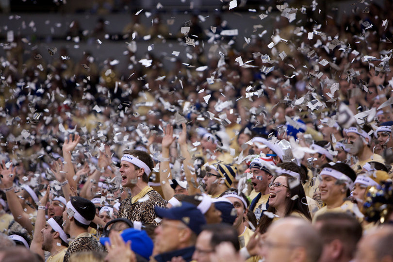 The Pitt "Zoo" explodes with shreads of newspapers after the Panthers' first basket at the Petersen Events Center on Saturday. Pitt defeated the Orange 65-55 in the Big East matchup. 