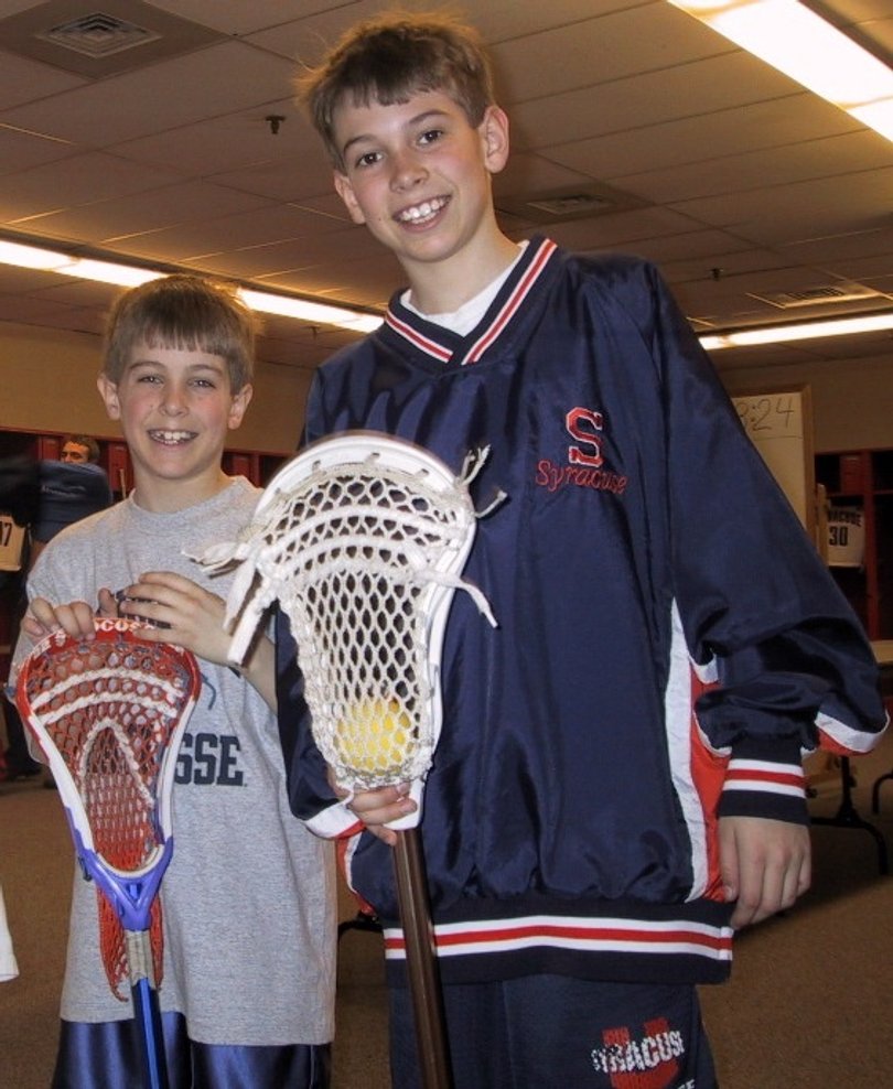 Dylan Maltz, 9 (left) and Derek Maltz, 11 (right) in the Carrier Dome locker room in 2003.