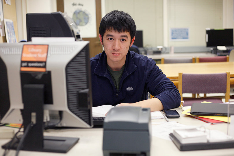 Alvin Huyhn works at Bird Library through the work study program. 