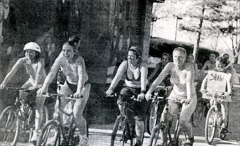 Students participate in a naked bike ride in 2000 to protest SU's affiliation with sweatshops.