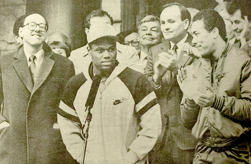 (front row from left to right) Jim Boeheim, Greg Monroe, then-Mayor Tom Young and Howard Triche stand before a crowd of 3,000 in downtown Syracuse celebrating the team's run to the national championship.