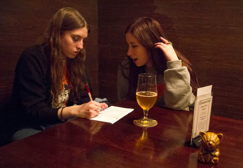 Megan Corbet, a senior PR and Marketing double major, and Zoe Topper, a PR senior, try to name all of the bastard surnames in Westeros during and Game of Thrones trivia night at the Beer Belly Deli and Pub.