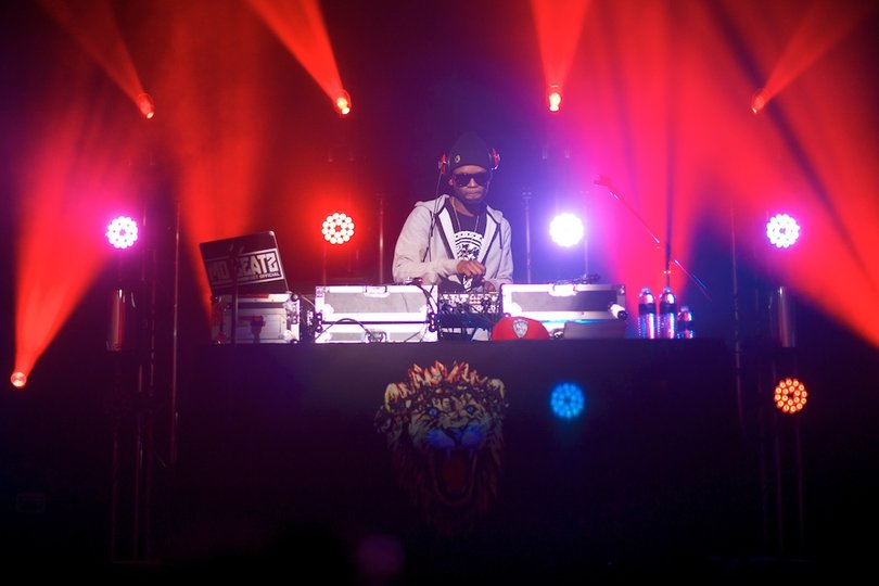 Big Sean's DJ performs and energizes the crowd before Big Sean takes the stage.
