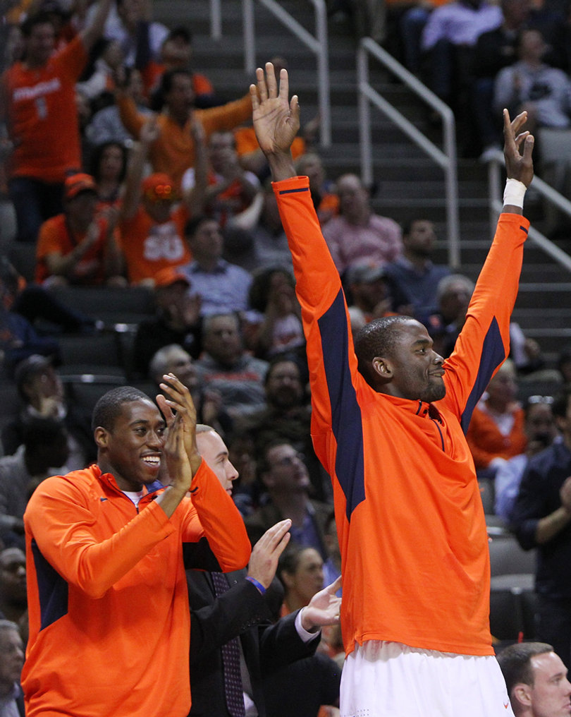 Matt Lyde-Cajuste #14 (L) and Baye Moussa-Keita #12 (R) of the Syracuse Orange celebrate after a play against the Montana Grizzlies.