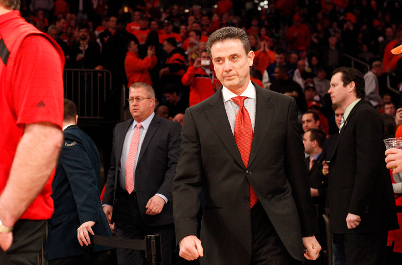 Rick Pitino walks onto the court at Madison Square Garden.