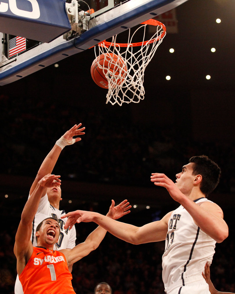 Michael Carter-Williams makes a contested shot inside.