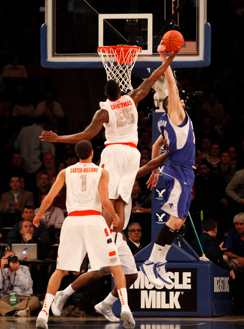 Rakeem Christmas (middle) blocks Aaron Geramipoor's (right) attempt at an offensive rebound.