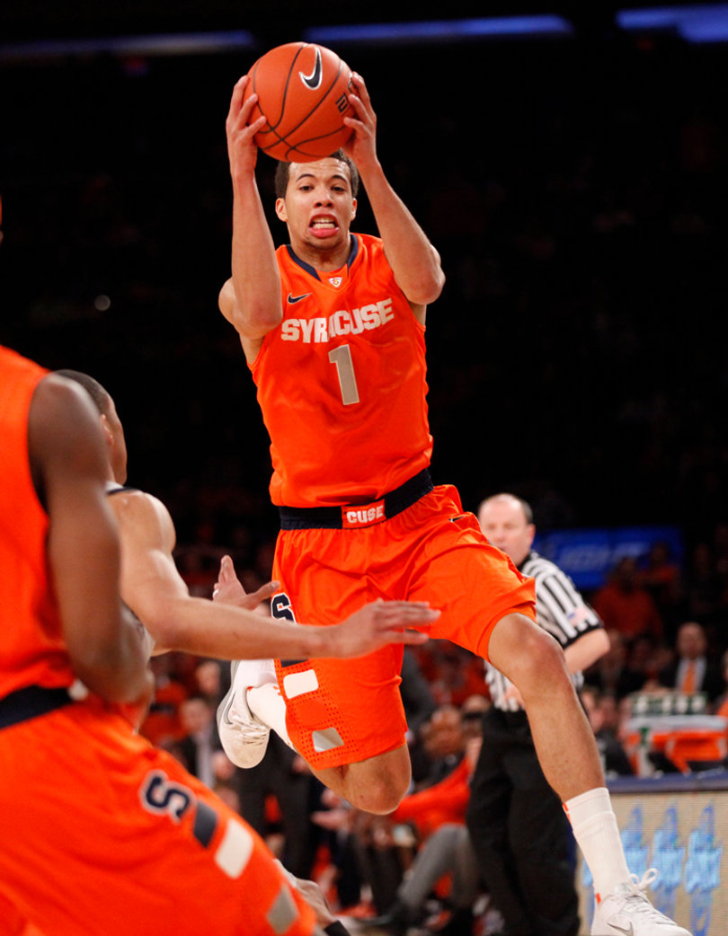 Michael Carter-Williams saves a ball from going out of bounds in the first half of the Big East tournament semifinals. 