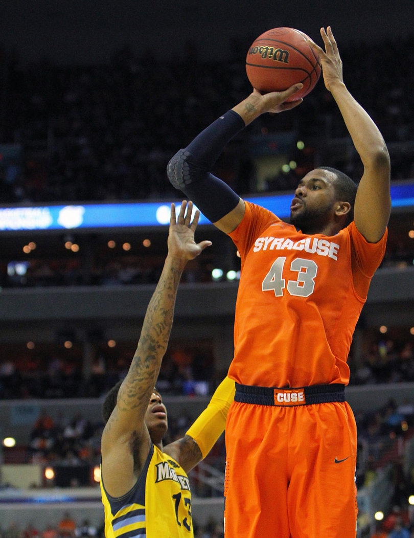 James Southerland #43 of the Syracuse Orange shoots the ball late in the game against Vander Blue #13.
