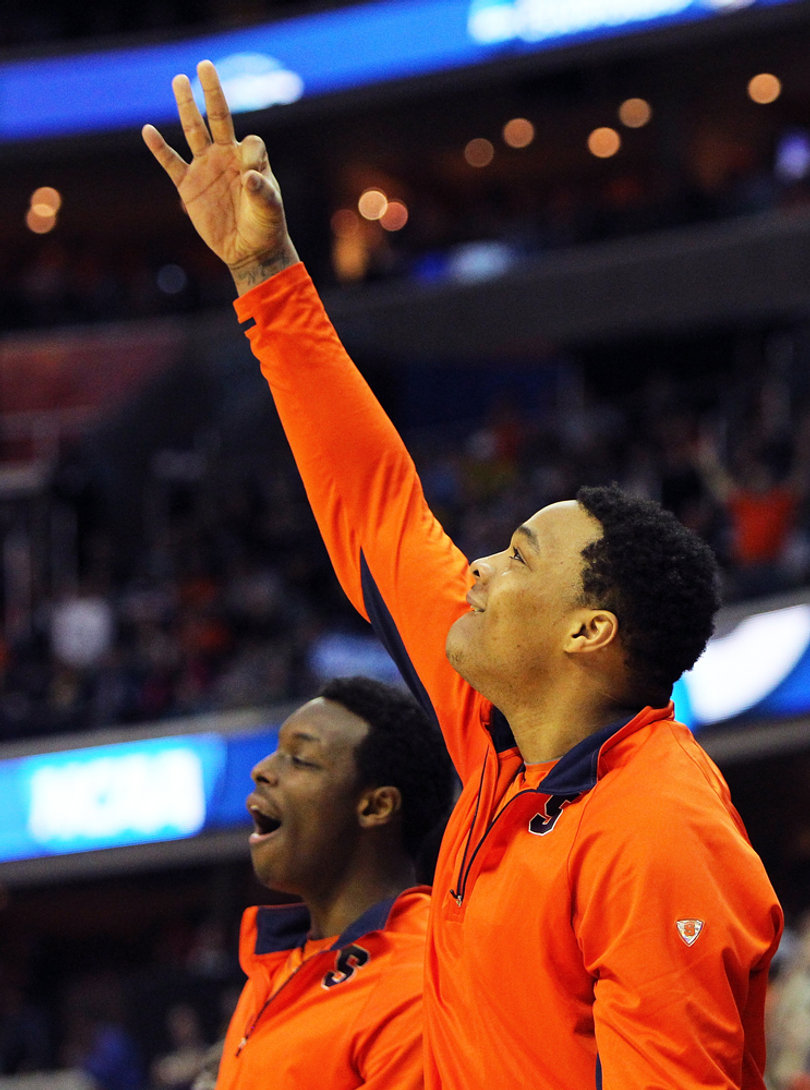 DaJuan Coleman #32 of the Syracuse Orange celebrates as he signals a three point play late in the game against the Marquette Golden Eagles.