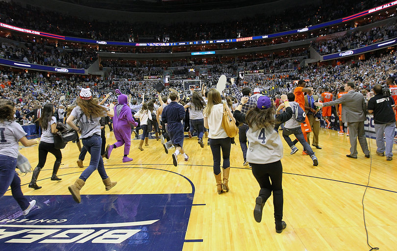 Fans storm the court following Georgetown's win in the Big East regular-season finale.