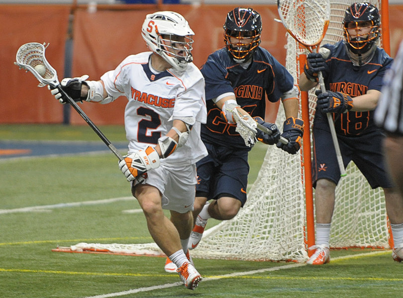 Syracuse attack Kevin Rice breaks away from Virginia defenders.