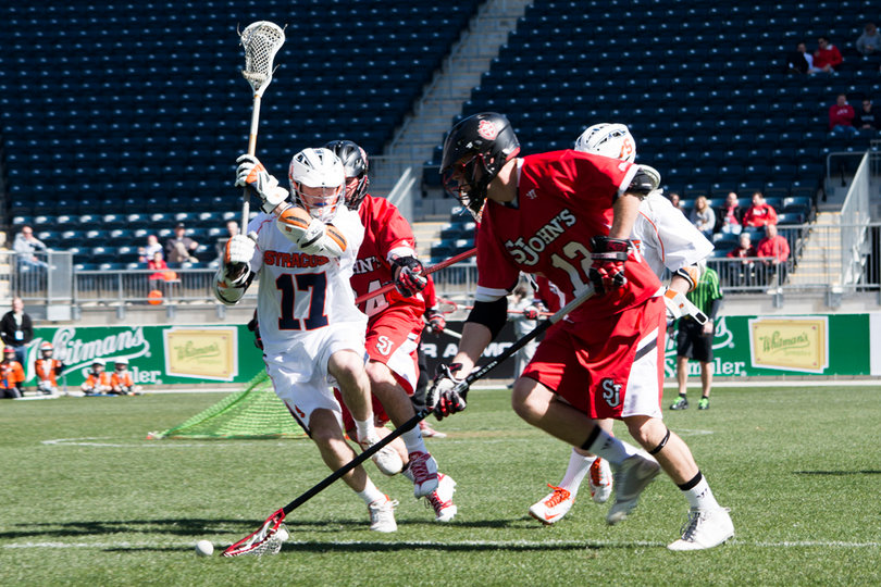 Drew Viscusi picks up a ground fall for St. John's, while Dylan Donahue defends.