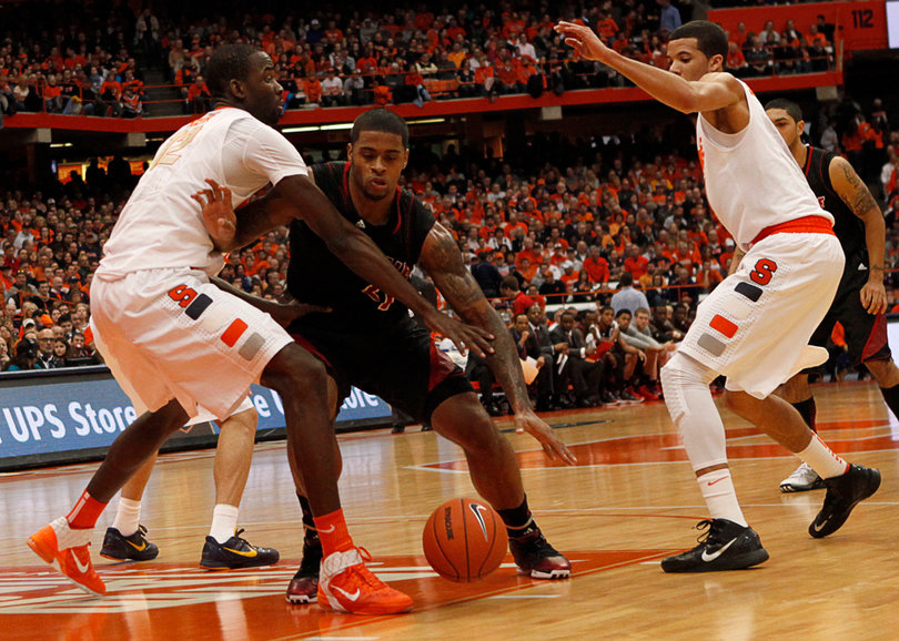 Baye Moussa Keita defends Chane Behanan in the paint. Keita played just 14 minutes, grabbing three rebounds and turning in an assist.