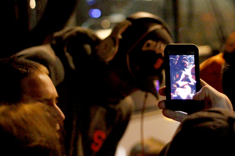 Fans cheer on James Southerland as he exits the bus at the Carmelo K. Anthony Basketball Center. 