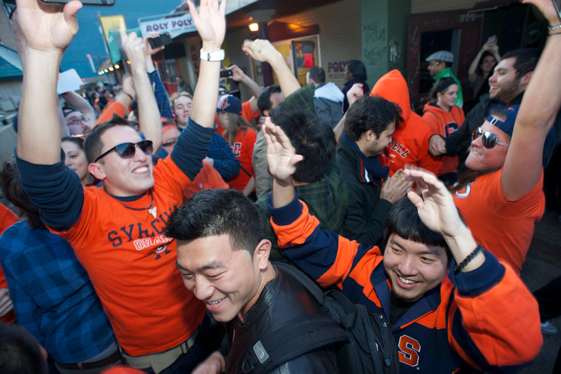 Syracuse University students celebrate outside of Chuck's Cafe.