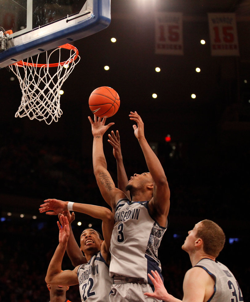 Georgetown's Mikael Hopkins (#3) attempts a defensive rebound.