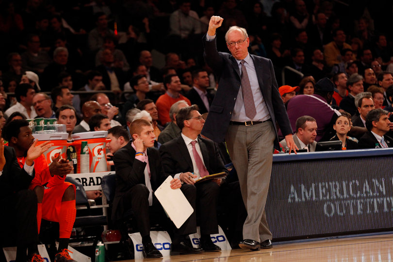 Head coach Jim Boeheim cheers from the sidelines as Syracuse holds off Georgetown into the second half.
