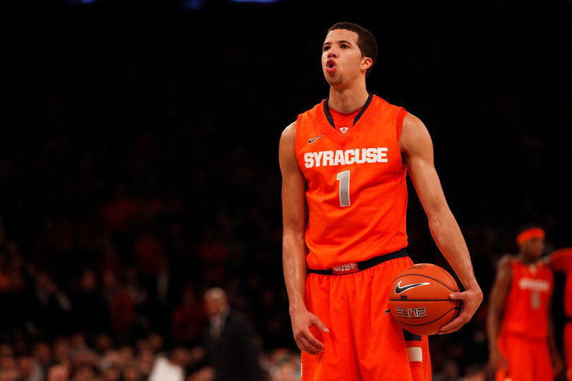 Michael Carter-Williams pauses before taking a free throw.