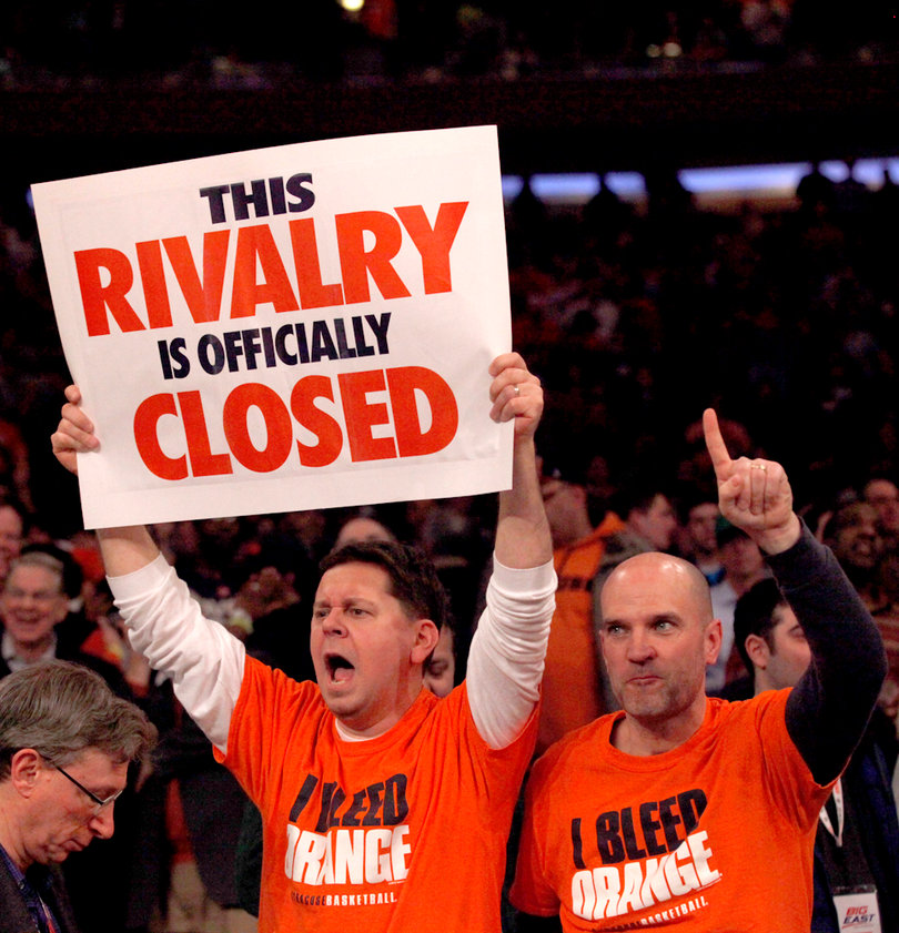 John Groat (left) a Syracuse local, and Denis Hickey (right), of Camillus cheer at the end of Syracuse vs. Georgetown matchup at Madison Square Garden.