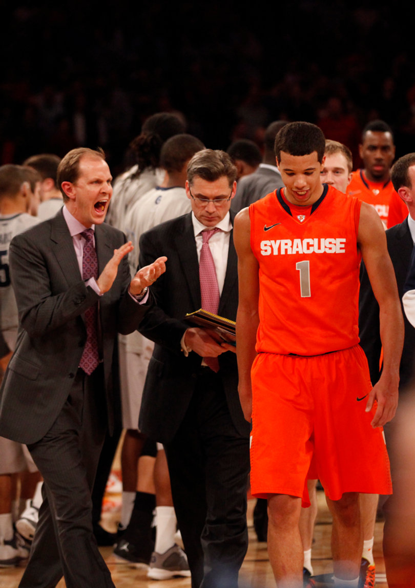 Michael Carter-Williams grins as he walks off the court after successfully defeating Georgetown in the Big East Tournament at Madison Square Garden.