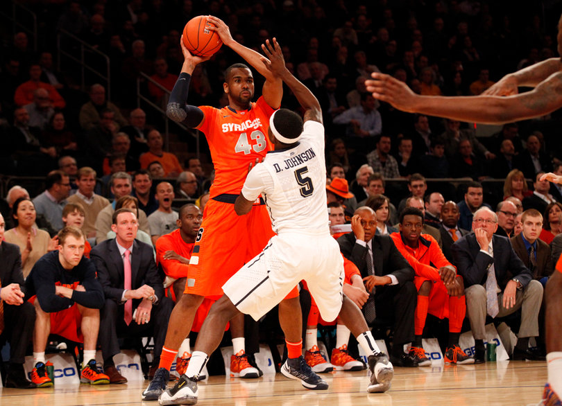 James Southerland dribbles the ball near the baseline, looking for an open teammate.