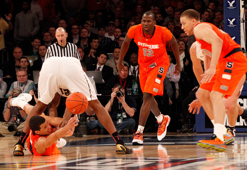 Michael Carter-Williams Passes the ball through the legs of Pittsburgh's Lamar Patterson (#21) to Brandon Triche.