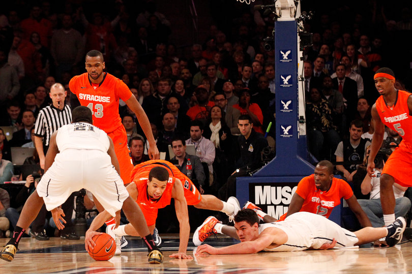 Michael Carter-Williams dives for a ball fumbled by Pittsburgh.