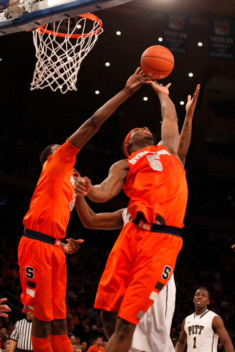 C.J. Fair misses the basket and tries to make a rebound.