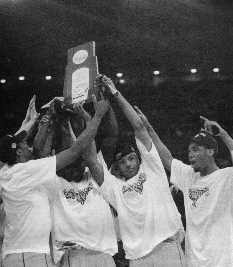 2003: Carmelo Anthony and his Syracuse teammates hold up the national championship trophy.