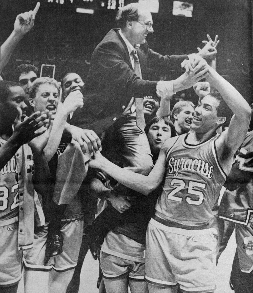1987: Syracuse players carry Jim Boeheim off the court after the Orange's Elite Eight win over Providence.