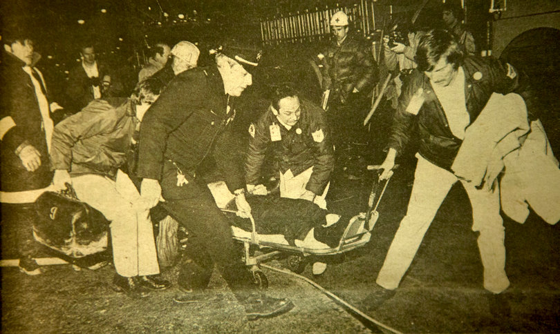 Syracuse police officers carry the victims of the fire at 701 University Ave. The four firefighters died after entering the building in hopes of rescuing people still trapped inside.