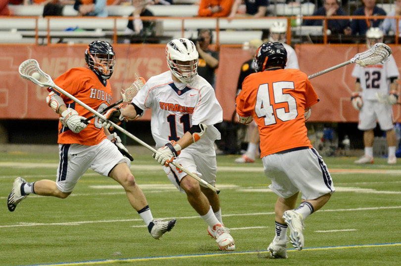Brian Megill carries the ball out of SU's defensive end. The senior captain won a ground ball and caused a turnover but struggled to contain Hobart's Alex Love.