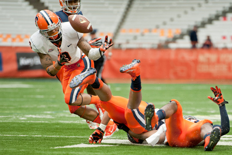 Syracuse cornerback Ri'Shard Anderson attempts an interception.