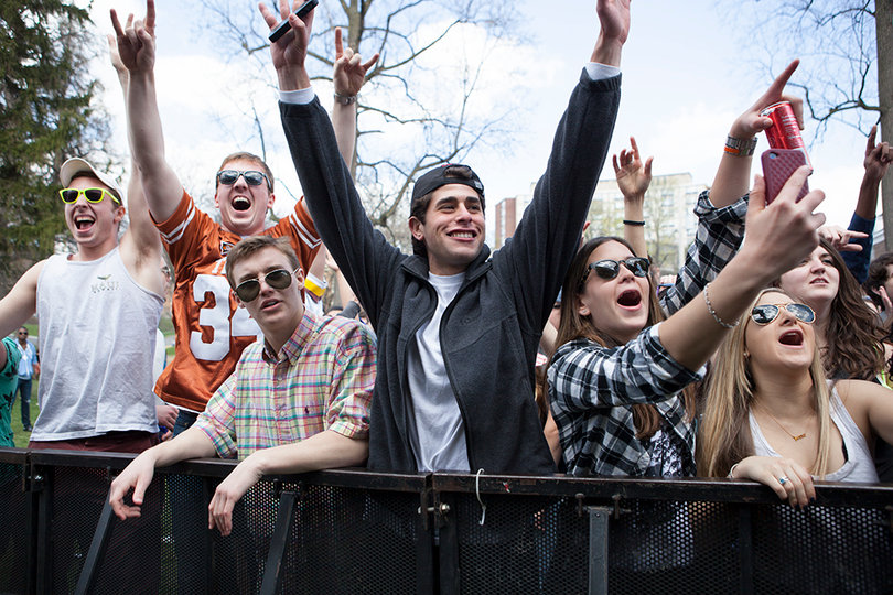 Students cheer as Sound Remedy performs on stage at MayFest, Friday afternoon.