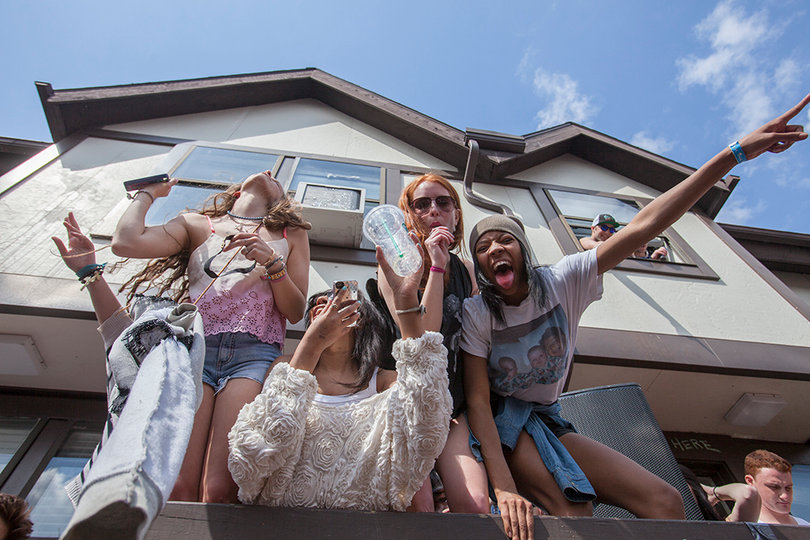 Party goers celebrate on top of a platform in Castle's Court.