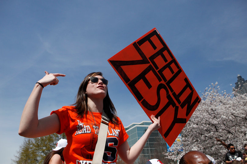 Evelyn Burgess, a freshman at Syracuse University, taunts Michigan fans in Centennial Park.