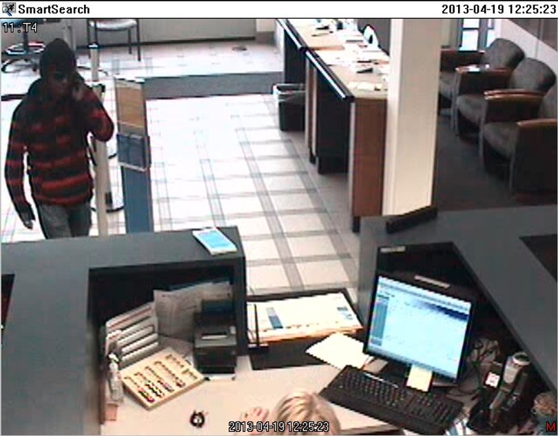The Syracuse Police Department has released two photos of the suspected robber. 