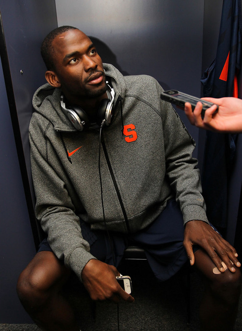 Baye Moussa-Keita (12) of the Syracuse Orange responds in the locker room during the Final Four interviews