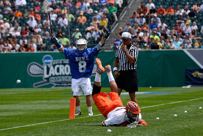 Duke's Josh Dionne celebrates while Brian Megill falls to the ground.